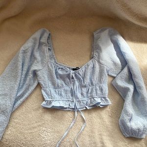 Lulu’s floral light blue cropped long sleeve top